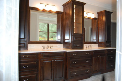 Bathroom - huge traditional gray tile and ceramic tile ceramic tile bathroom idea in Other with an undermount sink, raised-panel cabinets, dark wood cabinets, marble countertops, a two-piece toilet and gray walls