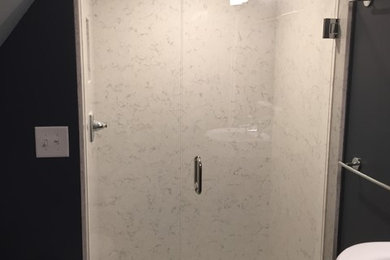 Example of a small trendy 3/4 white tile and marble tile dark wood floor and brown floor alcove shower design in Atlanta with flat-panel cabinets, dark wood cabinets, a two-piece toilet, gray walls, a vessel sink, wood countertops and a hinged shower door