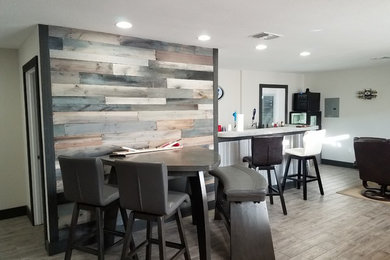 Seated home bar - mid-sized rustic galley porcelain tile and gray floor seated home bar idea in Other with concrete countertops