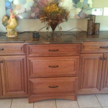 Omega Cabinetry.  Destin door, Cherry wood, Nutmeg stain.