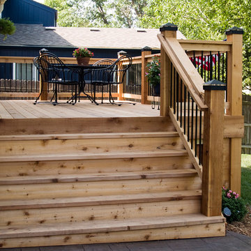 Stoerman - Cedar deck in Overland Park, Ks.  Stamped concrete patio & deck light