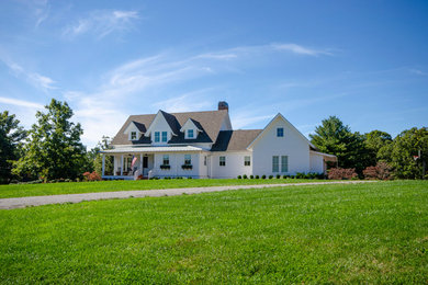 Example of a farmhouse exterior home design in Other