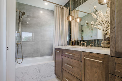 Inspiration for a transitional multicolored tile and subway tile porcelain tile, beige floor and single-sink bathroom remodel in San Francisco with shaker cabinets, medium tone wood cabinets, white walls, an undermount sink, marble countertops, white countertops and a built-in vanity
