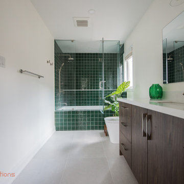 Vibrant Green Ceramic Tiles Bring Life to a Hallway Bathroom