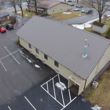 Metal roof and seamless gutters on a Church building