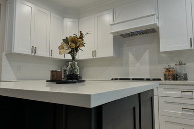 Mid-sized transitional u-shaped ceramic tile and beige floor open concept kitchen photo in Houston with shaker cabinets, white cabinets, quartz countertops, white backsplash, ceramic backsplash, stainless steel appliances, an island and white countertops