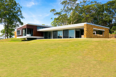 This is an example of a large contemporary one-storey exterior in Sydney.