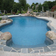 Concrete pool deck with flagstone coping