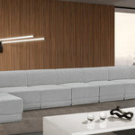Meridian Furniture - Ollie Black Boucle Fabric U-Shaped Modular Sectional, Grey, 9-Piece: 7 Armless Chair, 2 Corner Chair - The Ollie Boucle Fabric Sectional is a truly stunning piece that boasts an elegant and attention-grabbing design. It is upholstered in a rich grey boucle fabric that feels soft and smooth to the touch, making it the perfect addition to any space that requires a touch of sophistication and style. The sectional's modular design ensures that it can easily fit into any room layout, while its plush cushioning provides optimum comfort for you and your guests. Whether you're entertaining guests or simply relaxing after a long day, the Ollie sectional is the perfect piece to help you unwind in style.