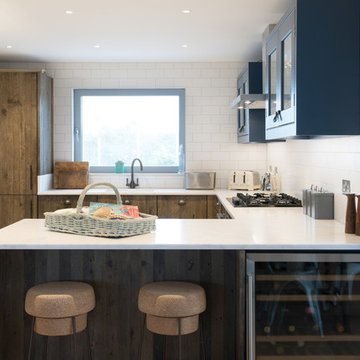 Industrial Rustic kitchen with doors made from 100 year old Reclaimed wood.