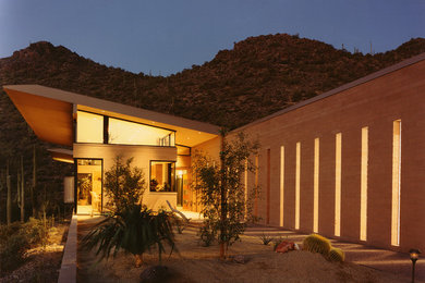 Trendy one-story exterior home photo in Phoenix with a shed roof