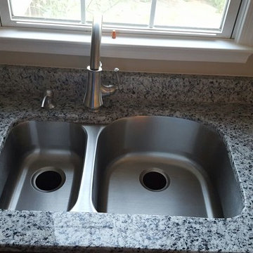 This exquisite Luna Pearl was the perfect finishing touch for this kitchen.