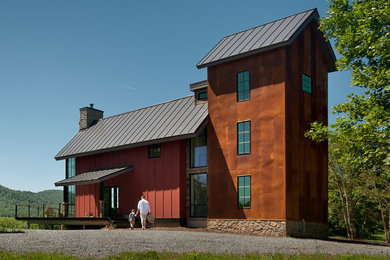 Inspiration for a contemporary three-story mixed siding house exterior remodel in DC Metro with a hip roof and a metal roof