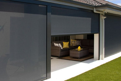 Photo of a modern home design in Cairns.