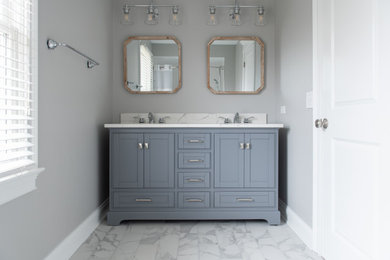 Bathroom - mid-sized transitional kids' porcelain tile, white floor and double-sink bathroom idea in Chicago with shaker cabinets, gray cabinets, a two-piece toilet, gray walls, an undermount sink, quartz countertops, white countertops and a freestanding vanity