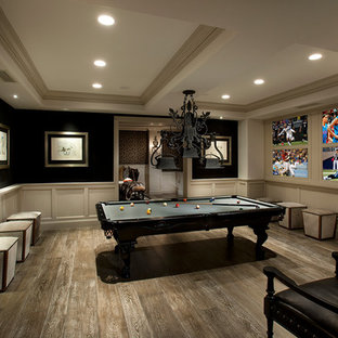 Photo of an expansive classic enclosed home cinema in Phoenix with beige walls, light hardwood flooring, a built-in media unit and brown floors.