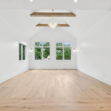 Vaulted Living Room with Exposed Beams and Natural Light