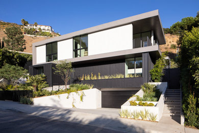 Example of a trendy white mixed siding exterior home design in Los Angeles