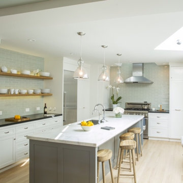 2x8 Oyster Shell tiles set in an offset pattern, from counter to ceiling.