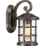 Quoizel - Crusade 1-Light Outdoor Lantern, Palladian Bronze - Inspired by Craftsman design the Crusade Outdoor Series is clean and classic. Encased in the crisscrossed bands the clear seedy glass emits plenty of light. The fixture body is created using a composite material suitable for extreme temperatures and is resistant to fading. It is a wonderful addition to the Coastal Armour Collection. Available in Mystic Black and Palladian Bronze finishes. (Please note that the vintage bulbs are not included but are available for purchase.)