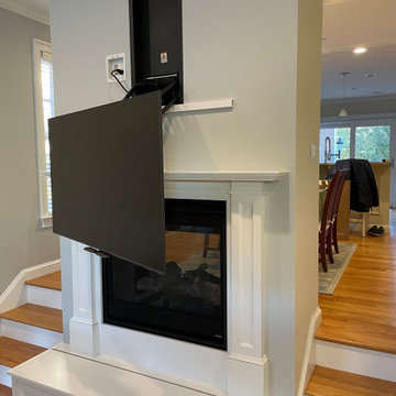Pull-Down TV mounted over fireplace