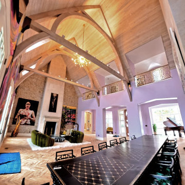 Statement Great Room with Sculptural Beams, Custom Furnishings, and Artful Finis