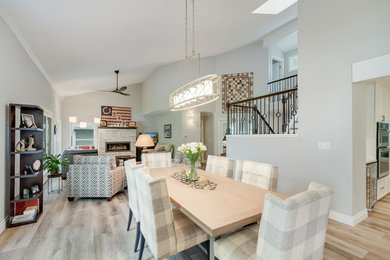 Dining room - transitional vinyl floor dining room idea in Denver