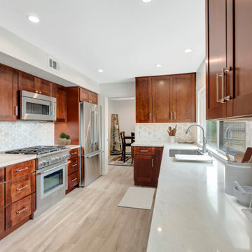 Modern Warmth: Kitchen Remodel with Rich Wood Cabinetry & Geometric Backsplash