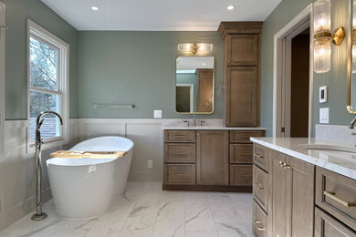 Example of a large transitional master cement tile and beige tile ceramic tile, white floor and double-sink bathroom design in Cincinnati with recessed-panel cabinets, dark wood cabinets, green walls, an undermount sink, quartz countertops, a hinged shower door, white countertops and a built-in vanity