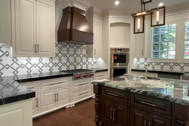 Inspiration for a huge transitional kitchen remodel in Dallas with raised-panel cabinets and an island