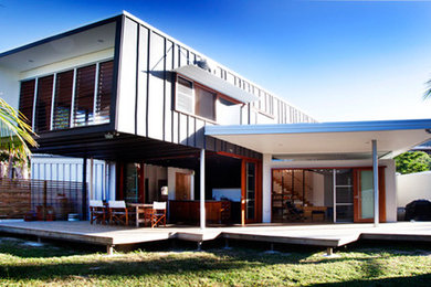 Mid-sized contemporary two-storey exterior in Brisbane.