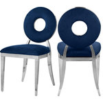 Meridian Furniture - Carousel Upholstered Dining Chair, Set of 2, Navy Velvet, Chrome Finish - Yield to the decorator within when you bring home this Carousel velvet dining chair. This chair features a metal frame and legs finished in chrome stainless steel for a modern touch, but the real star of the show is the donut-shaped seat back that exudes undeniable contemporary charm. The seat and back are both plumply filled for comfort and upholstered in soft navy velvet for a chic look.