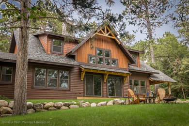 Rustic brown two-story wood exterior home idea in Minneapolis