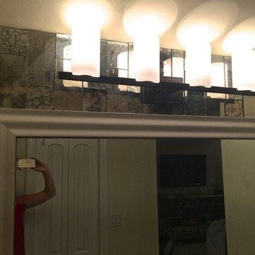 Bathroom redo with framed mirror and antique mirror tiles