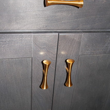 Kitchen - gray island with brushed brass hardware