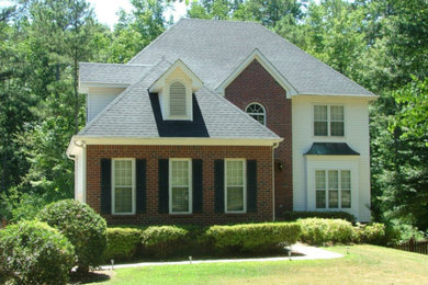 Mid-sized elegant white two-story mixed siding house exterior photo in Atlanta with a hip roof and a shingle roof