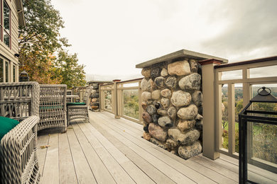 Example of an arts and crafts deck design in Other