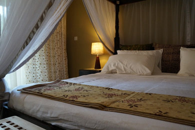 Bedroom - rustic bedroom idea in Other