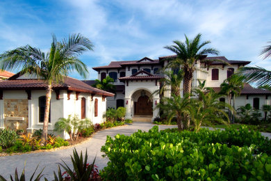 Example of a tuscan exterior home design in Miami