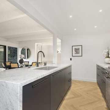 After - Marble Waterfall Island Over the Herringbone Floor