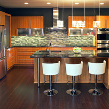 White Kitchen With Black Island Multi Colored Bamboo Flooring
