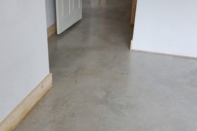 Inspiration for a craftsman master concrete floor bedroom remodel in Austin with gray walls