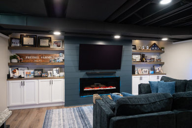Example of a small classic formal and open concept vinyl floor, brown floor and exposed beam living room design in Detroit with a hanging fireplace, a shiplap fireplace and a wall-mounted tv