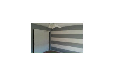 Striped walls and accent walls painted by Hadley & Son Painting