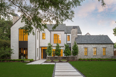 Transitional white two-story brick exterior home idea in Dallas with a shingle roof and a gray roof