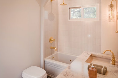 Mid-sized danish white tile and ceramic tile ceramic tile, multicolored floor and double-sink bathroom photo in Los Angeles with beige cabinets, a wall-mount toilet, beige walls, an integrated sink, beige countertops and a built-in vanity