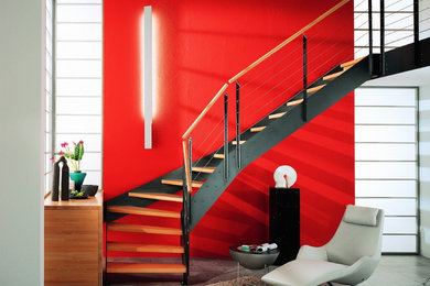 Réalisation d'un escalier minimaliste en L avec des marches en bois.