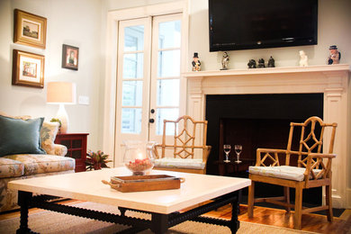 Example of a classic family room design in Charleston