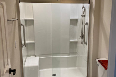 Inspiration for a mid-sized modern vinyl floor, gray floor and single-sink sliding shower door remodel in Seattle with a two-piece toilet and a pedestal sink