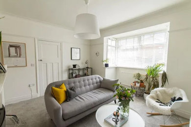 Design ideas for a medium sized scandinavian living room in Other with white walls, carpet and grey floors.